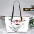 Watercolor dragonfly sitting on flower leather tote bag