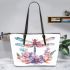Watercolor dragonfly surrounded in the style of flowers leather tote bag