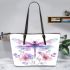 Watercolor dragonfly surrounded in the style of flowers leather tote bag