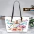 Watercolor dragonfly surrounded in the style of flowers leather tote bag