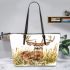 Whitetail deer buck standing in tall grass with daisies leather totee bag