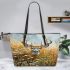 Whitetail deer buck standing in tall grass with daisies leather totee bag