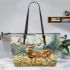 Whitetailed buck standing in meadow with daisies leather totee bag