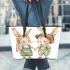 Adorable two bunnies holding hands dressed in green leather tote bag