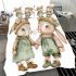 Adorable two bunnies holding hands dressed in green bedding set