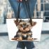 Baby yorkshire terrier puppy in full body isolated leather tote bag