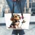 Beagle puppy holding a pink rose in its mouth leather tote bag