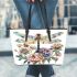 Beautiful dragonfly sitting on top of flowers leather tote bag