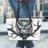 Black and white owl with bright teal eyes leather tote bag