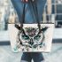 Black and white owl with teal highlights leather tote bag