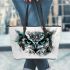 Black and white owl with turquoise highlights leather tote bag