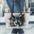 Black and white owl with turquoise highlights leather tote bag