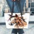 Brown horse with white and black feathers on its head leather tote bag