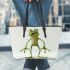 Cartoon frog standing on its hind legs leaather tote bag