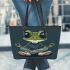 Cartoon frog with big eyes wearing white and brown shoes leaather tote bag