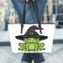 Cartoon green frog wearing black witch hat leaather tote bag