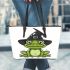 Cartoon green frog with black witch hat leaather tote bag