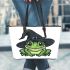 Cartoon green frog with black witch hat leaather tote bag