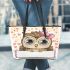Cartoon owl with a pink bow on its head leather tote bag