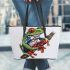 Cartoon tattoo design of a red eyed tree frog sitting on a branch leaather tote bag