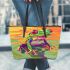 Colorful cartoon red eyed tree frog on the edge leaather tote bag