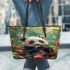 Cute baby panda eating bamboo leather tote bag