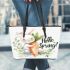 Cute bunny sitting on top of an carrot hello spring leather tote bag