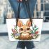 Cute cartoon baby bunny with big eyes sitting leather tote bag