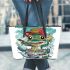 Cute cartoon frog eating ramen shown in a full body shot leaather tote bag