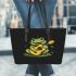 Cute cartoon frog playing guitar in a simple drawing leaather tote bag