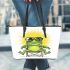 Cute cartoon frog sitting in a lawn chair with big sunglasses on leaather tote bag