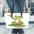 Cute cartoon frog sitting on a lily pad leaather tote bag