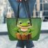 Cute cartoon frog sitting on a tree stump leaather tote bag