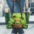 Cute cartoon frog sitting on a tree stump with big eyes leaather tote bag