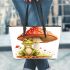 Cute cartoon frog sitting under an amanita muscaria mushroom leaather tote bag