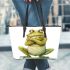 Cute cartoon frog with its front legs crossed leaather tote bag