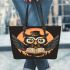 Cute cartoon owl wearing glasses and holding an open book leather tote bag