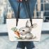 Cute cartoon rabbit holding a carrot leather tote bag