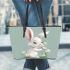 Cute cartoon rabbit holding daisies leather tote bag