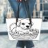 Cute cartoon style labrador puppy sitting in flower basket leather tote bag