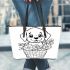 Cute cartoon style labrador puppy sitting in flower basket leather tote bag