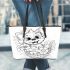 Cute cartoon style puppy sitting in flower basket leather tote bag