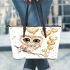 Cute chibi owl with big eyes holding heart shaped balloons leather tote bag