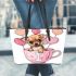 Cute chihuahua puppy inside a pink teacup with candy hearts leather tote bag