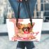 Cute chihuahua puppy inside a pink teacup with valentine candy leather tote bag