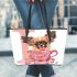 Cute chihuahua puppy inside a pink teacup with valentine candy leather tote bag