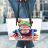 Cute colorful frog sitting on water leaather tote bag