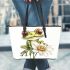 Cute frog sitting on the flower leaather tote bag