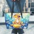 Cute frog wearing a crown sitting on a golden ball leaather tote bag