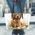 Cute golden retriever dog with easter eggs leather tote bag